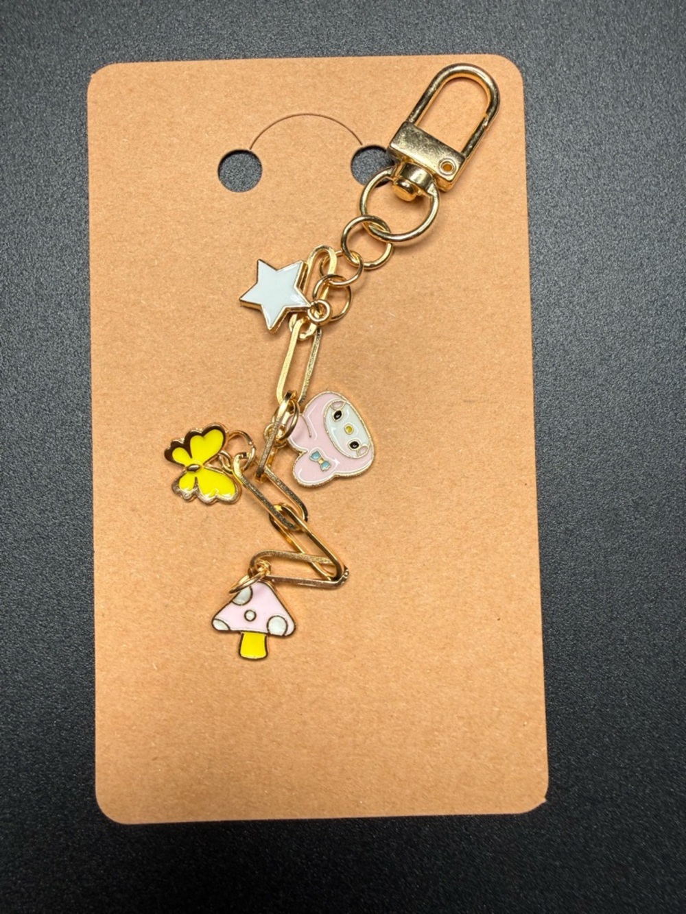 Sanrio themed gold tone keychain